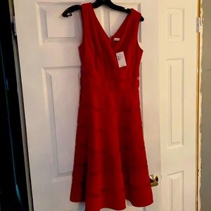 as 4 New with tags. Never worn. Deep red A line